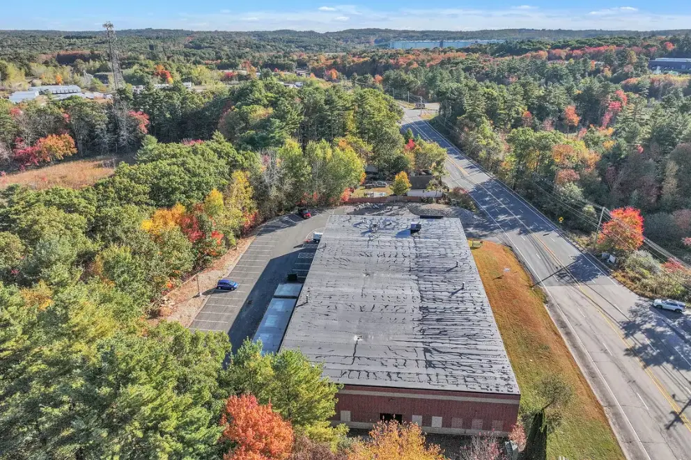 Aerial view over the roof toward the rear lot and loading area