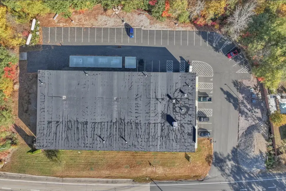 Top-down aerial view of the building footprint and parking lot