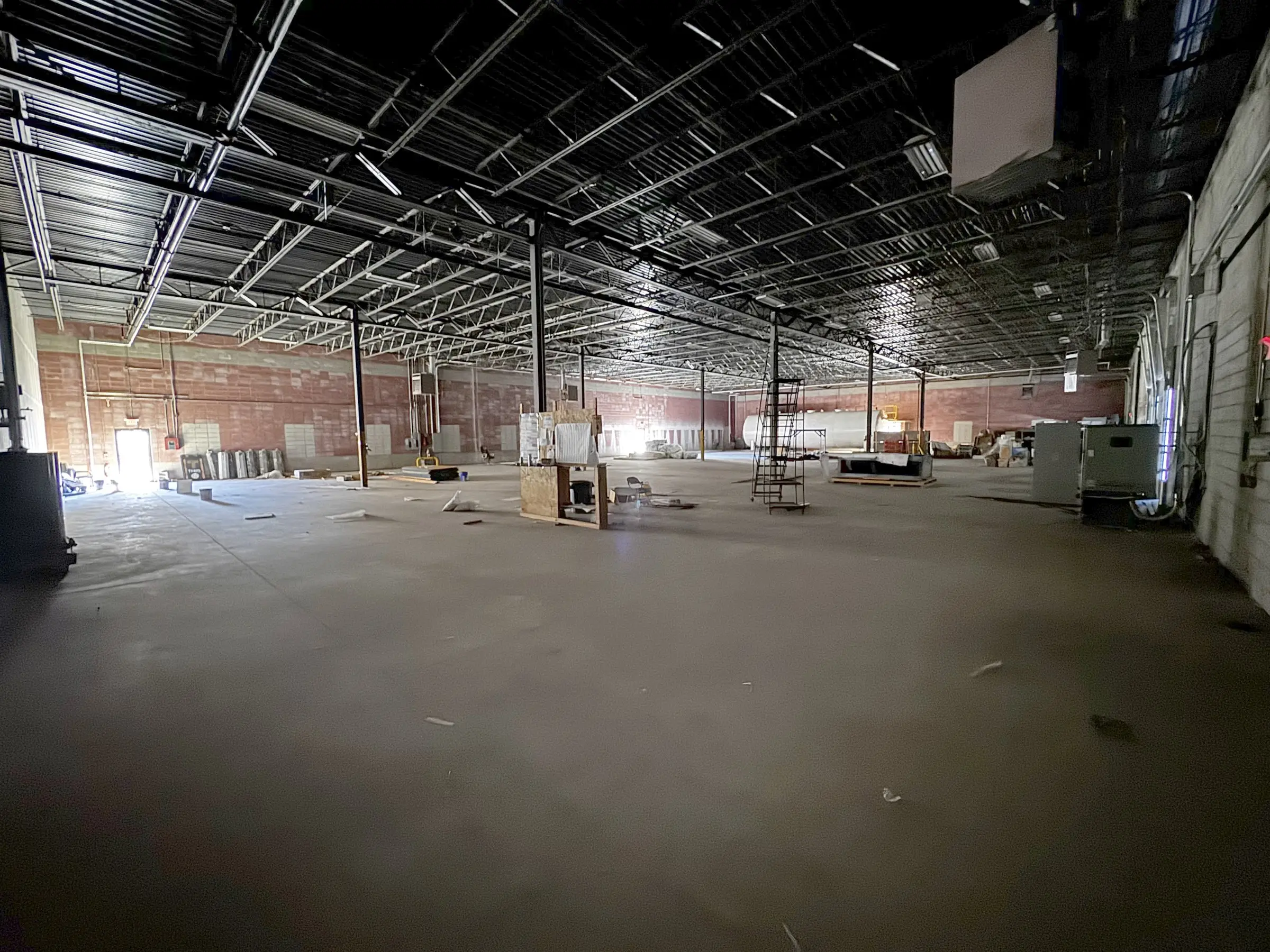 Long view down the length of the open warehouse floor